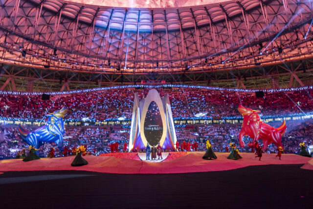 group of people in costume performing on stage